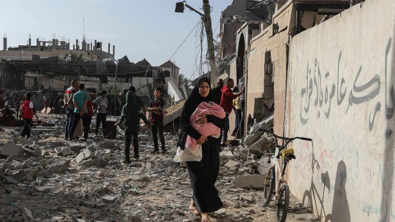 Palestinians inspect damaged houses after Israeli warplanes bombed a home for the Al-Shaer family, leading to widespread destruction in the Al-Salam neighbourhood, east of the city of Rafah, in the southern Gaza Strip on May 5, 2024.