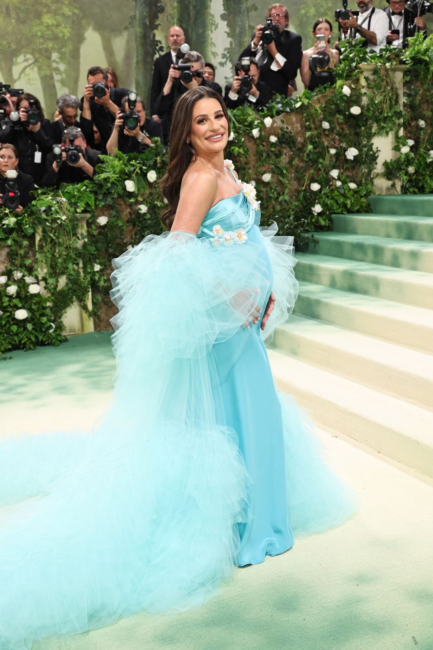 Lea Michele showed off her baby bump in a sky blue Rodarte dress. 