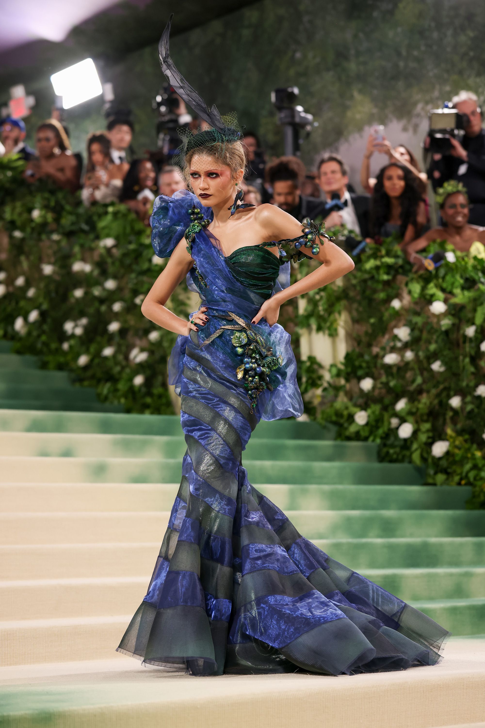 Zendaya's first look was a blue and green organza dress by Maison Margiela's John Galliano with grape and olive shaped embellishments. 