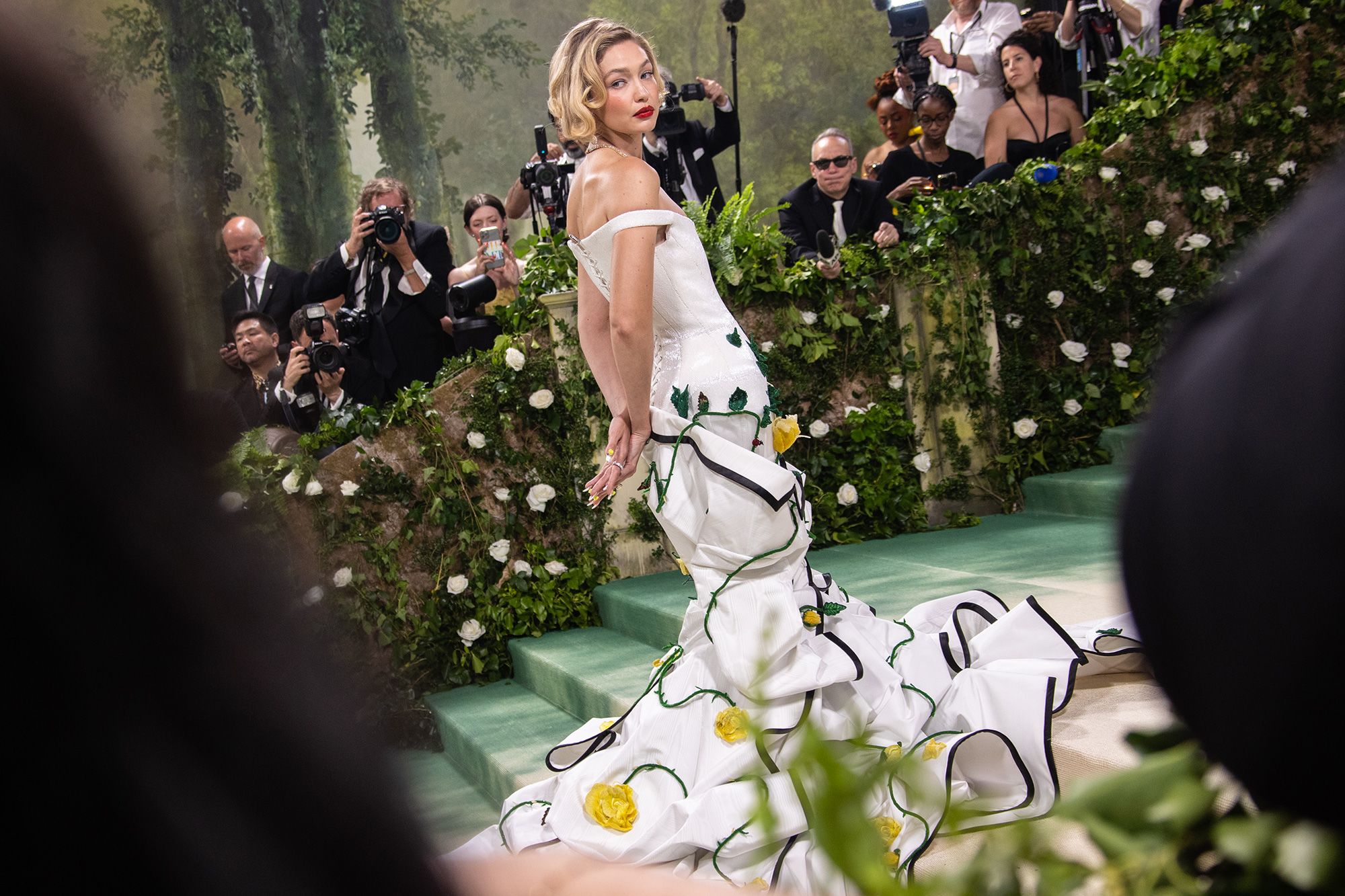 Gigi Hadid wore a sculptural Thom Browne number that saw an evening gown bloom from the shape of a tuxedo jacket. More than 70 people worked on this dress. <br /> 