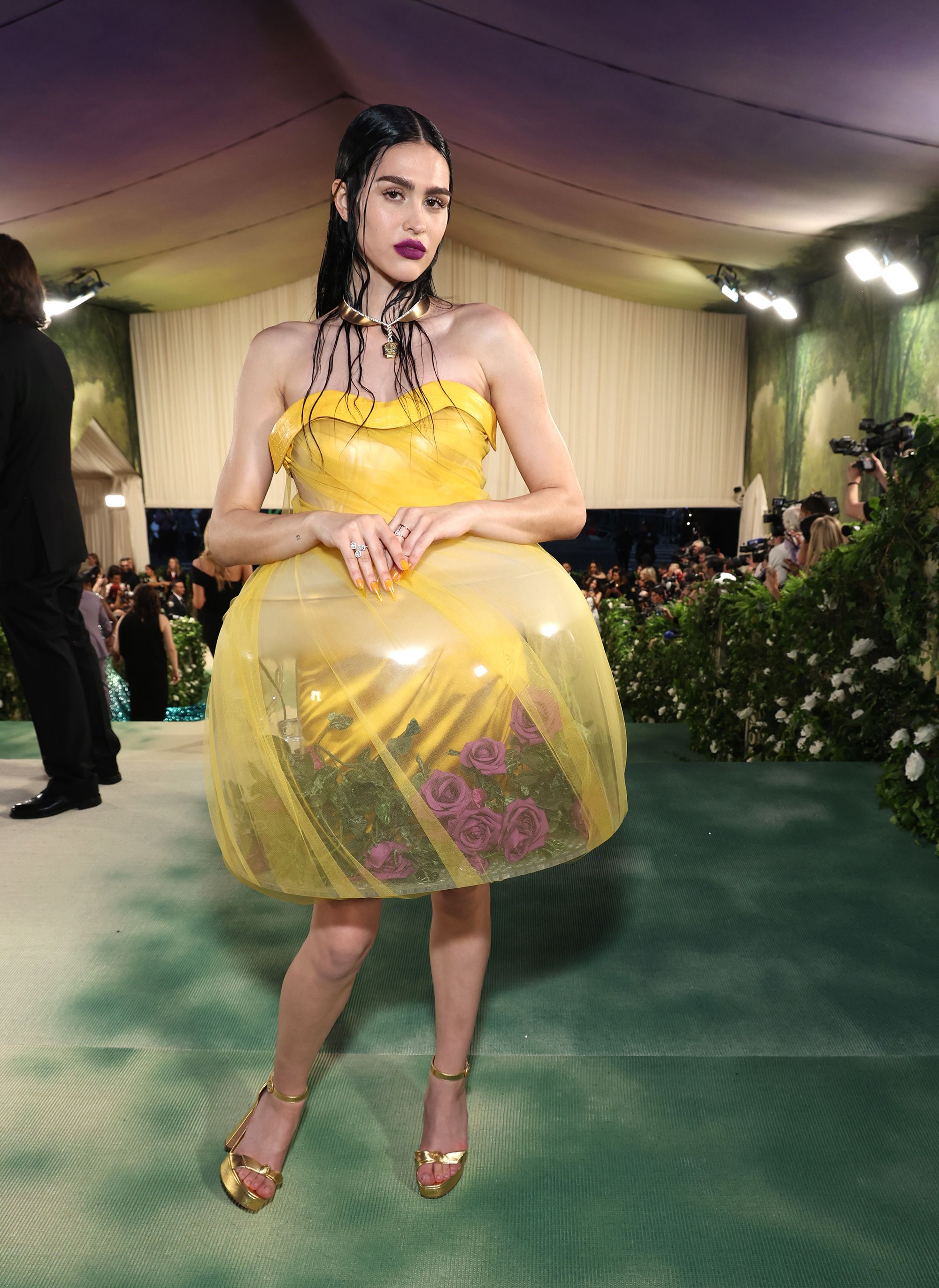 Amelia Gray wears one of the 'terrarium' dresses made by designer Jun Takahashi for his Spring 2024 Undercover show. 