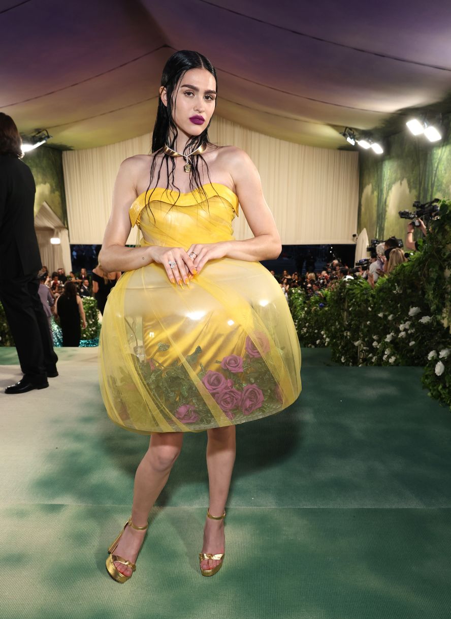 Amelia Gray wears one of the "terrarium" dresses made by designer Jun Takahashi for his Spring 2024 Undercover show.  