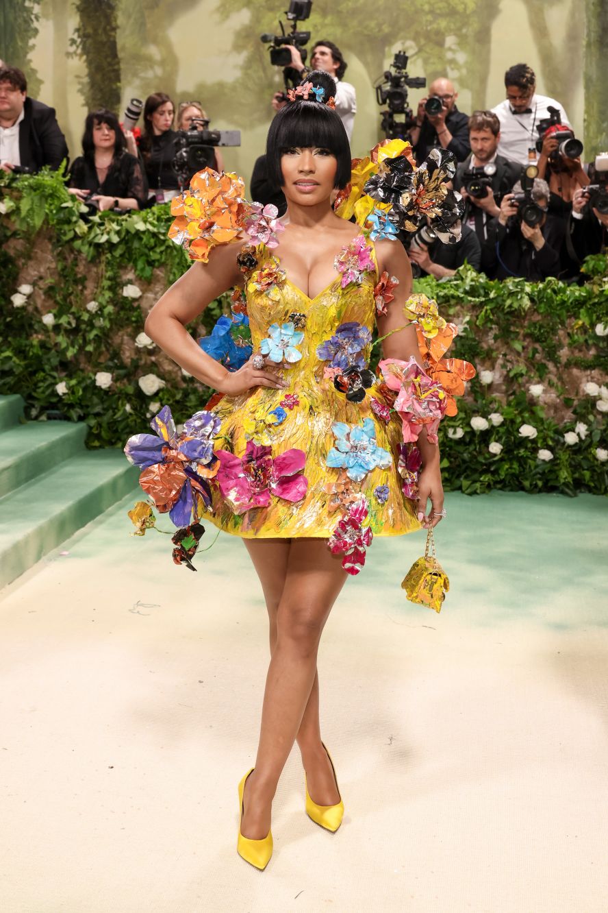 Nicki Minaj wore a short yellow Marni dress reminiscent of an artwork with papier-mâché-like flowers and embellishments that looked liked brush strokes.  