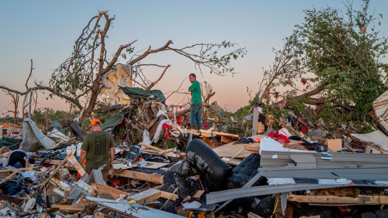 BARNSDALL, OKLAHOMA - MAY 07: The Crowder family surveys their home destroyed by a tornado on May 07, 2024 in Barnsdall, northeast Oklahoma. The EF3 twister that struck claimed one life and destroyed dozens of homes in the community of just over 1,000 people. (Photo by Brandon Bell/Getty Images)