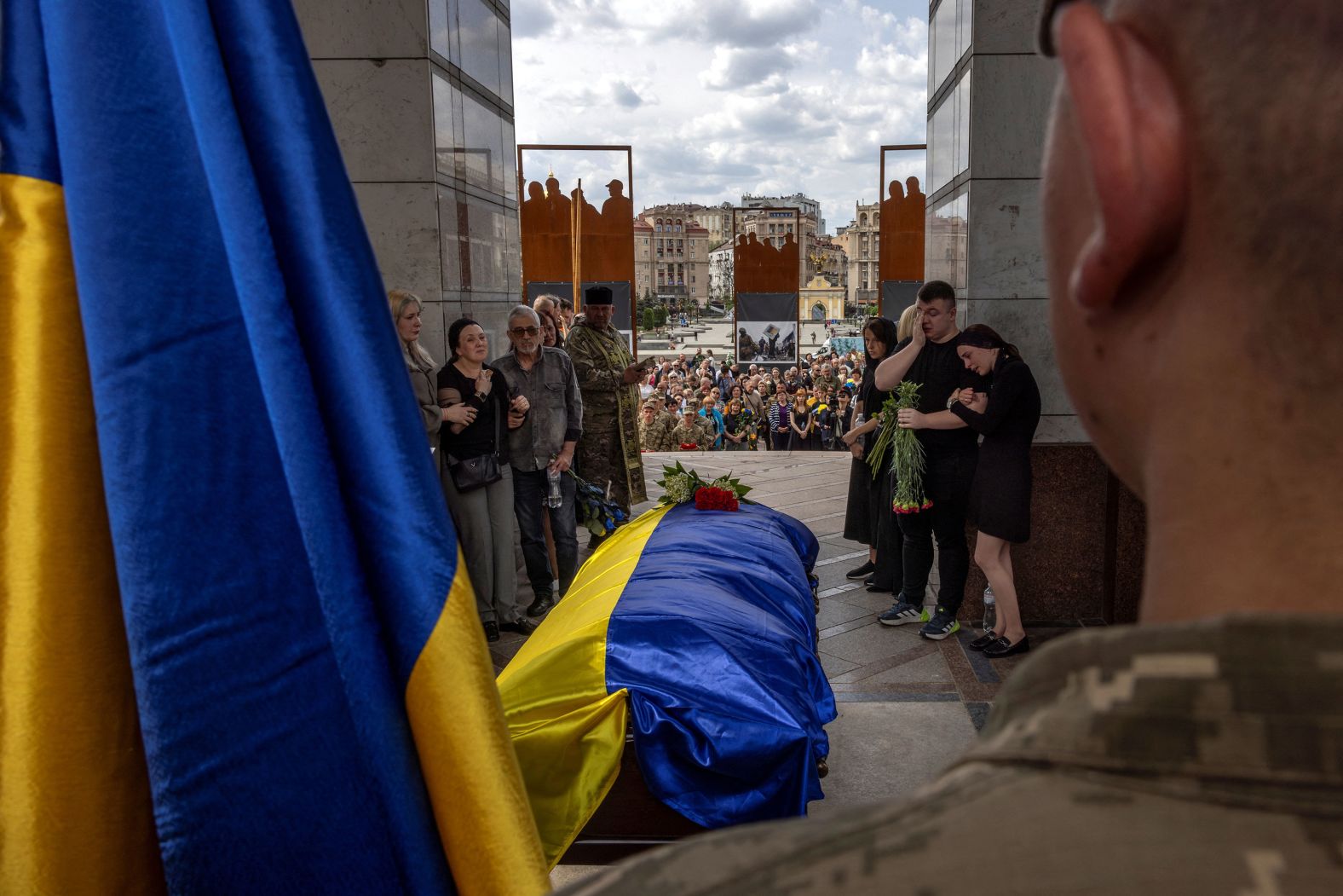 Relatives of Ukrainian soldier Eduard Hatmullin react during his commemoration ceremony, which was held Monday, May 6, at Independence Square in Kyiv, Ukraine. 