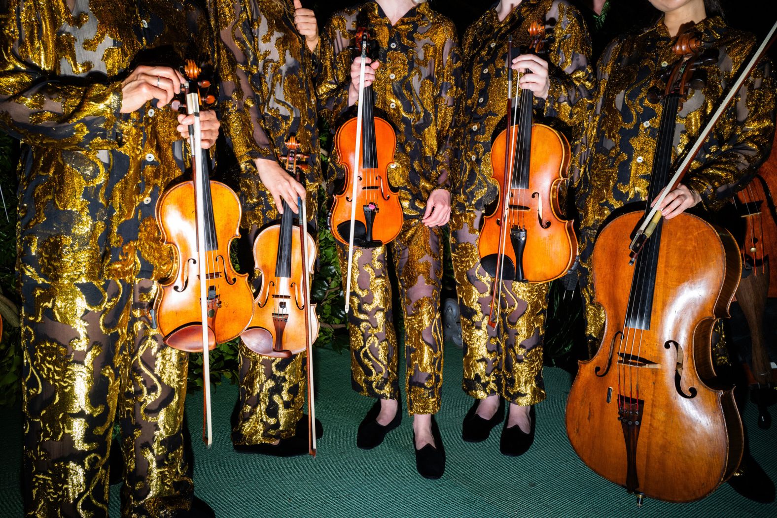 Performers wear gold and black at the Met Gala in New York on Monday, May 6. <a href="index.php?page=&url=https%3A%2F%2Fwww.cnn.com%2Fstyle%2Fgallery%2Fmet-gala-2024-red-carpet-fashion%2Findex.html" target="_blank">See the best looks from the night</a>.