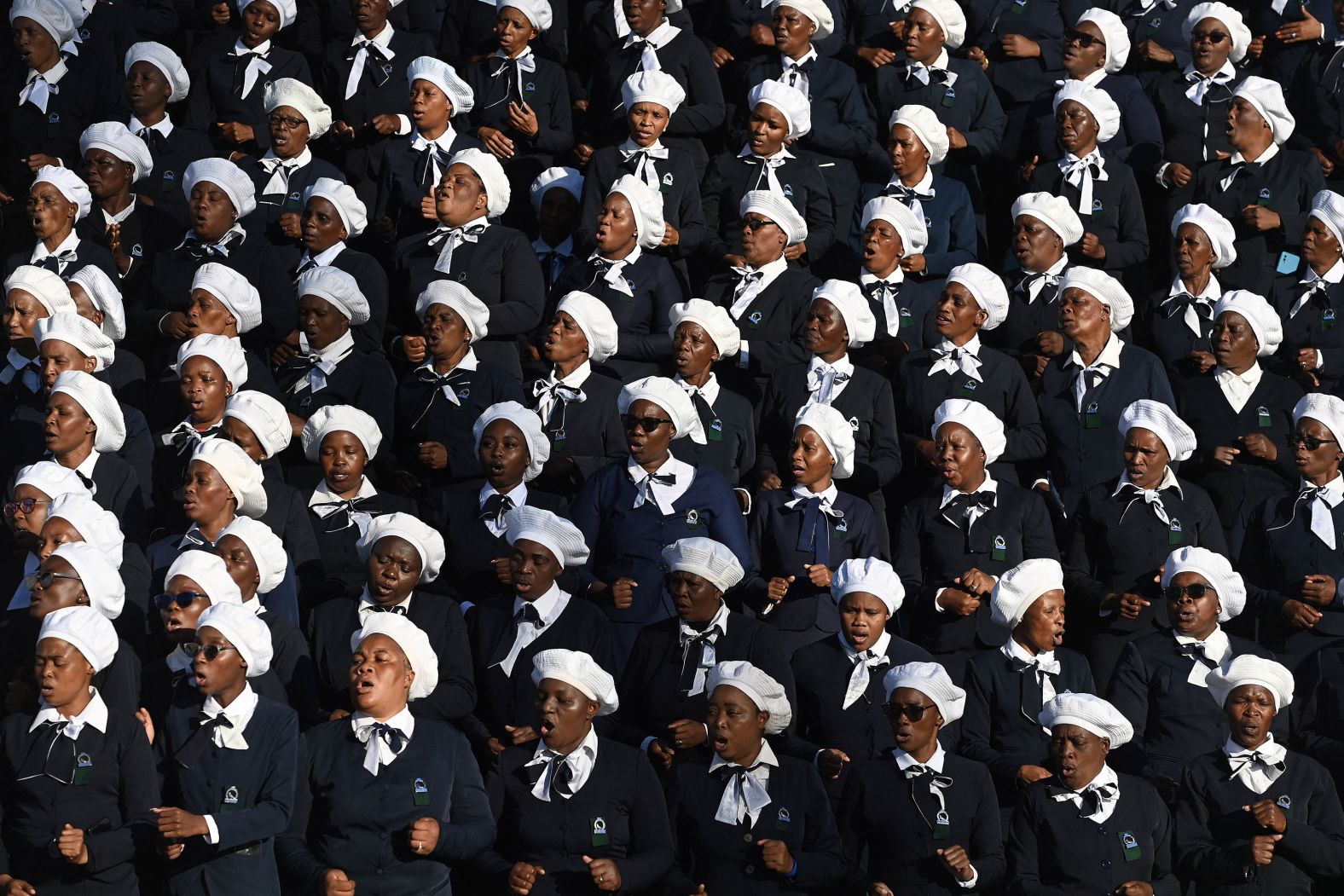 Members of the Zion Christian Church choir sing in Molepolole, Botswana, during a funeral ceremony held Saturday, May 4, for dozens of people <a href="index.php?page=&url=https%3A%2F%2Fwww.cnn.com%2F2024%2F03%2F28%2Fafrica%2Fbus-carrying-easter-worshippers-falls-off-cliff-intl%2Findex.html" target="_blank">who died in a South African bus accident in March</a>.