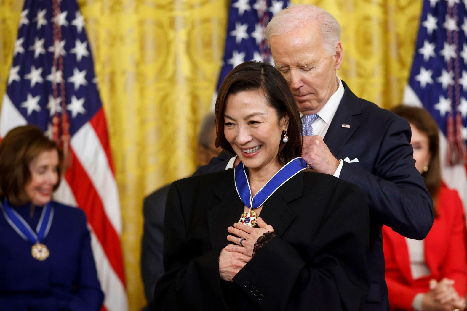 US President Joe Biden presents actress Michelle Yeoh with the Presidential Medal of Freedom, the country's highest civilian honor, during a ceremony at the White House on Friday, May 3. <a href="index.php?page=&url=https%3A%2F%2Fwww.cnn.com%2F2024%2F05%2F03%2Fpolitics%2Fbiden-medal-of-freedom%2Findex.html" target="_blank">Biden gave the medal to 19 Americans</a>, including high-profile political allies, celebrities and civil rights leaders.