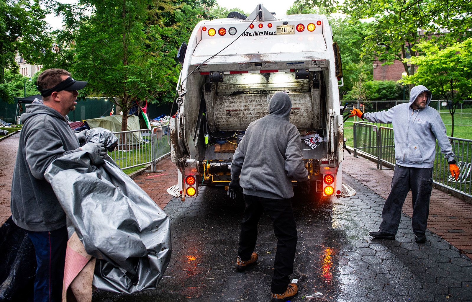 Maintenance staff and waste disposal crews clean up after police cleared a pro-Palestinian protest encampment on the campus of the University of Pennsylvania in Philadelphia on May 10.