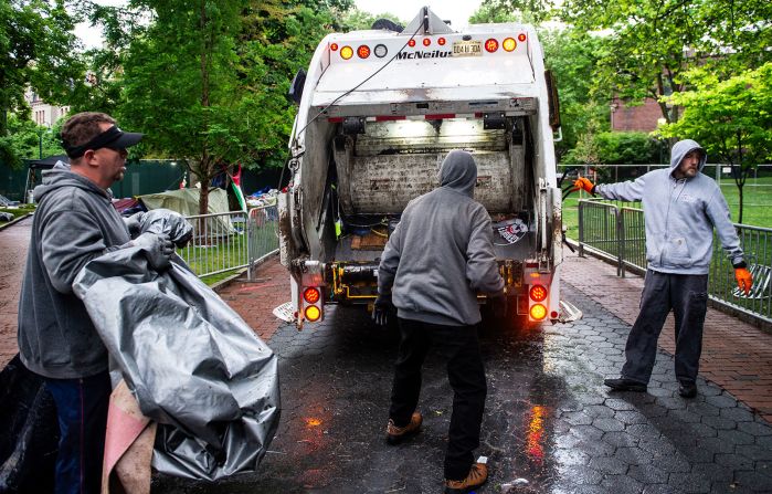 Maintenance staff and waste disposal crews clean up after police cleared a pro-Palestinian protest encampment on the campus of the University of Pennsylvania in Philadelphia on Friday, May 10.