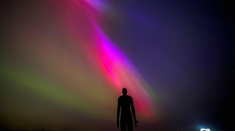 The aurora borealis, also known as the northern lights, glow on the horizon at Another Place by Anthony Gormley, Crosby Beach, Liverpool , Merseyside . Picture date: Friday May 10, 2024. (Photo by Peter Byrne/PA Images via Getty Images)