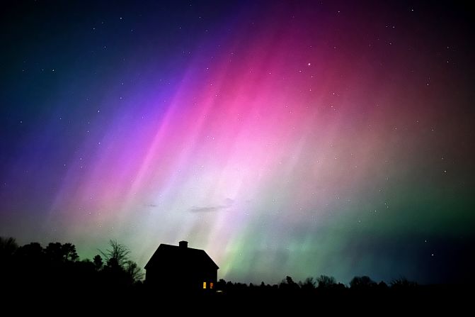 The northern lights flare in the sky over a farmhouse in Brunswick, Maine, on May 10.