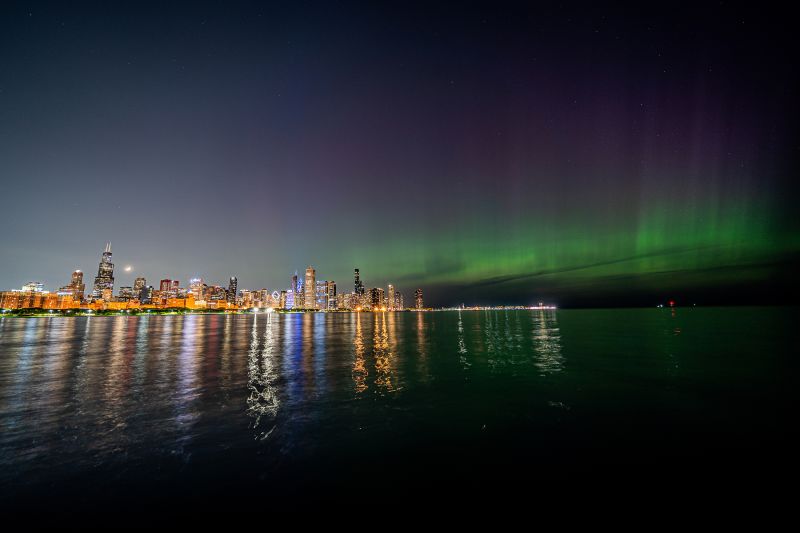 Northern Lights witnessed over the Chicago skyline as seen from the city's museum campus