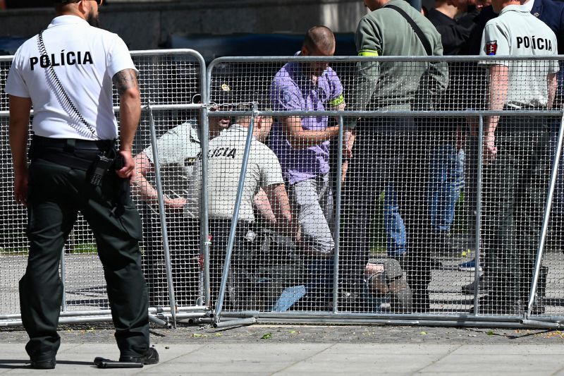 Security personnel apprehend a suspected gunman after Slovakia's Prime Minister was shot in Handlova, Slovakia on May 15, 2024.