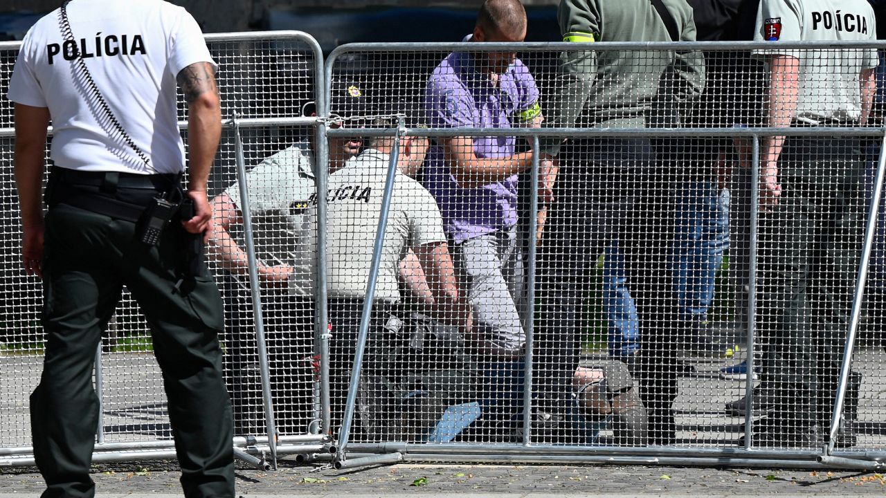 Picture taken on May 15, 2024 shows security personnel apprehending a suspected gunman (C/GROUND) after Slovakia's Prime Minister was shot in Handlova, Slovakia on May 15, 2024. Slovakia's Prime Minister Robert Fico was battling life-threatening wounds after officials said he was shot multiple times in an assassination attempt condemned by European leaders. (Photo by AFP) / ALTERNATIVE CROP (Photo by -/AFP via Getty Images)