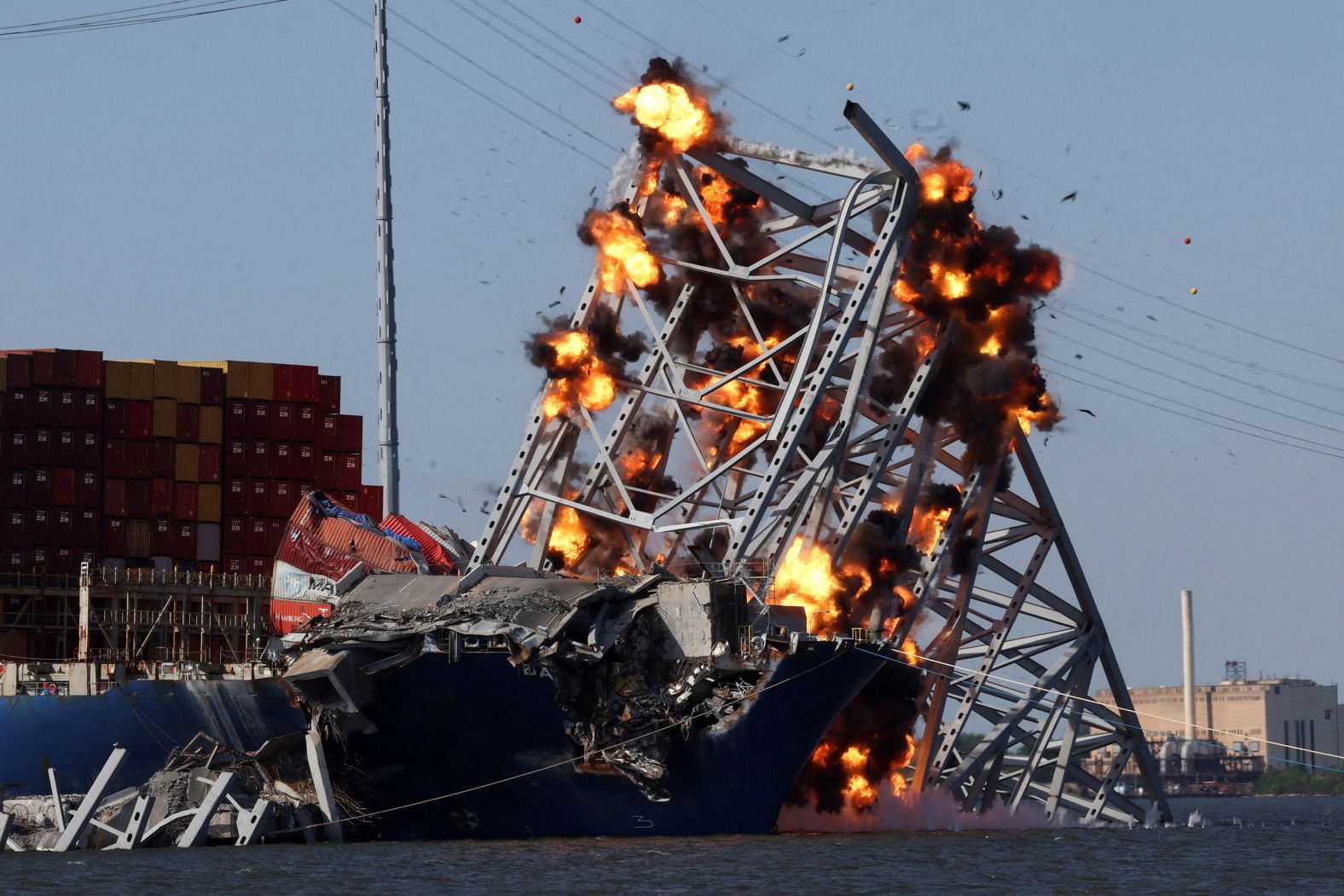 Explosive charges are set off at a portion of the collapsed Francis Scott Key Bridge in Baltimore on Monday, May 13. The charges helped demolish a portion of the bridge wreckage that was resting on the trapped cargo ship Dali. <a href="index.php?page=&url=https%3A%2F%2Fwww.cnn.com%2F2024%2F05%2F13%2Fus%2Fbaltimore-bridge-collapse-demolition-monday%2Findex.html" target="_blank">The move</a> was meant to help free the vessel nearly seven weeks after it struck the bridge and caused the span to collapse.