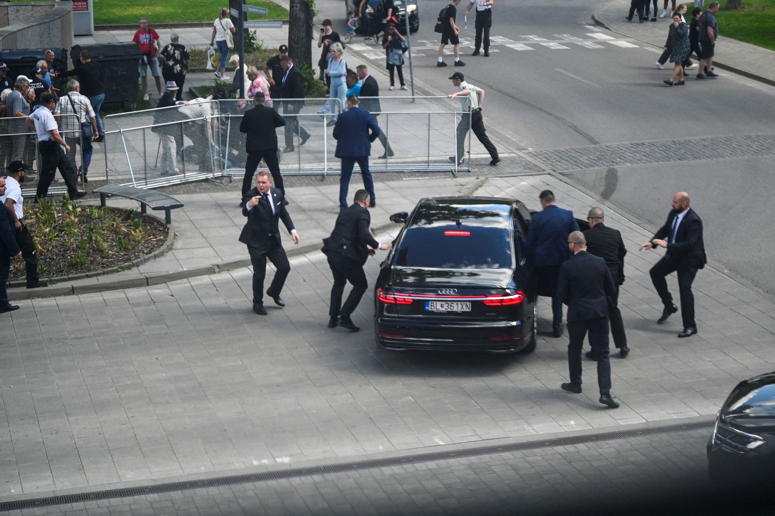 Security officers move Slovakian Prime Minister Robert Fico into a car after he was shot five times during an <a href="index.php?page=&url=https%3A%2F%2Fwww.cnn.com%2F2024%2F05%2F16%2Feurope%2Fslovakia-prime-minister-fico-out-of-danger-intl-hnk%2Findex.html" target="_blank">assassination attempt</a> in Handlová, Slovakia, on Wednesday, May 15. Fico was conscious and able to speak on Thursday afternoon, but he was still in serious condition, according to Slovakian President-elect Peter Pellegrini. Police have charged a man with attempted murder.