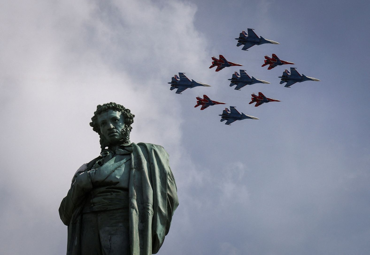 The Russian Knights aerobatic team flies over a monument of Russian poet Alexander Pushkin during a Victory Day parade in Moscow on Thursday, May 9. Victory Day marks the anniversary of the victory over Nazi Germany in World War II.