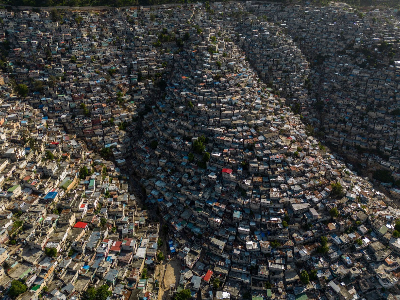 Houses sit on the slopes of the Jalousie neighborhood in Port-au-Prince, Haiti, on Monday, May 13. For more than two months, <a href="index.php?page=&url=https%3A%2F%2Fwww.cnn.com%2F2024%2F05%2F13%2Famericas%2Fhaiti-mss-unodc-guns-drugs-intl-latam%2Findex.html" target="_blank">Port-au-Prince has been cut off from the world</a>, its international seaport and airport shuttered following an explosion of gang attacks in late February.