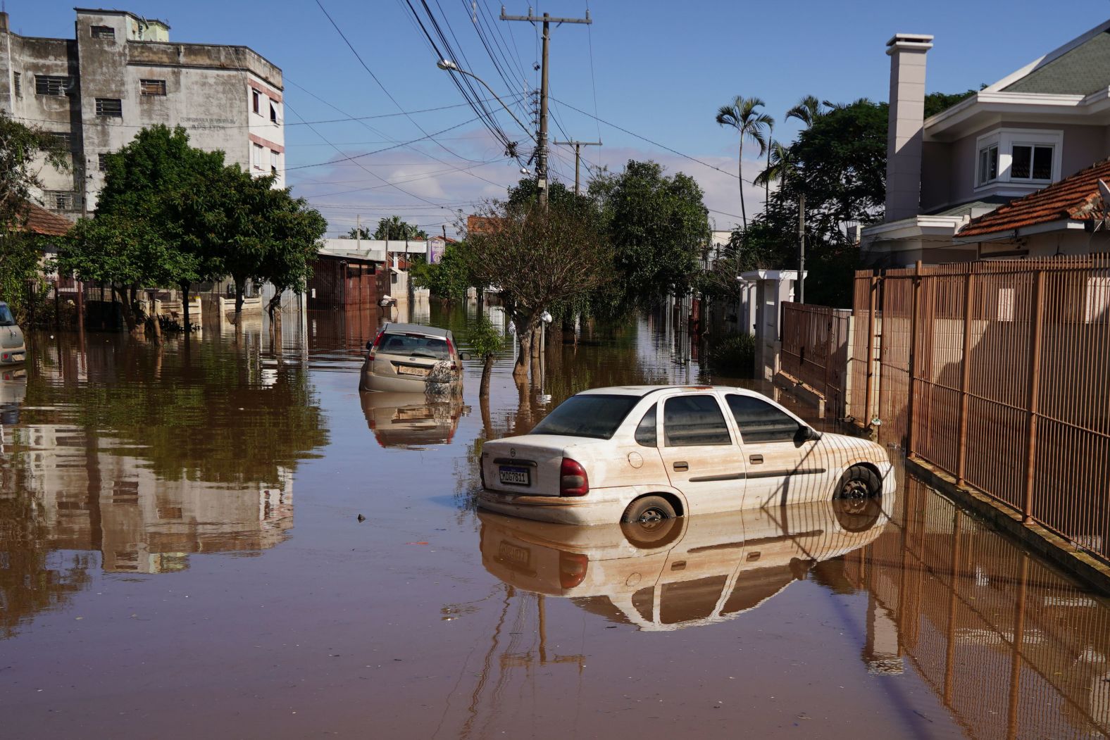 Cars are surrounded by flooded streets after heavy rain in Canoas, Brazil, on Thursday, May 9. Dozens of people have died in the <a href="index.php?page=&url=https%3A%2F%2Fwww.cnn.com%2F2024%2F05%2F09%2Fworld%2Fbrazil-floods-death-toll-intl-latam%2Findex.html" target="_blank">heavy rains and floods</a> that have torn through the state of Rio Grande do Sul.