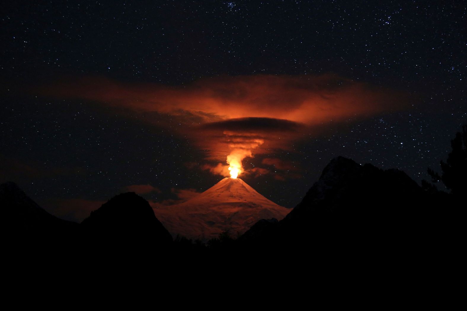 Activity from the Villarrica volcano is seen from Pucón, Chile, on Sunday, May 12.