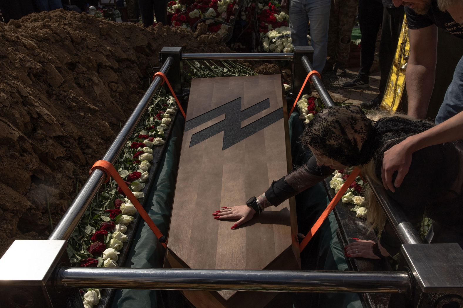 Mariana, mother of late Ukrainian serviceman Nazary Gryntsevych, gives a final touch to his coffin during his funeral in Vinnytsia, Ukraine, on Friday, May 10. <a href="index.php?page=&url=http%3A%2F%2Fwww.cnn.com%2F2024%2F05%2F09%2Fworld%2Fgallery%2Fphotos-this-week-may-2-may-9%2Findex.html" target="_blank">See last week in 32 photos</a>.