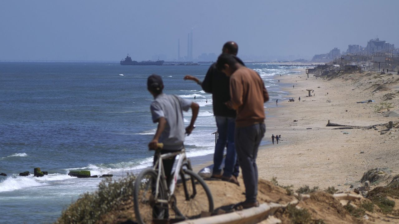 A ship is seen off the coast of Gaza near a U.S.-built floating pier that will be used to facilitate aid deliveries, as seen from the central Gaza Strip, Thursday, May 16, 2024. (AP Photo/Abdel Kareem Hana)