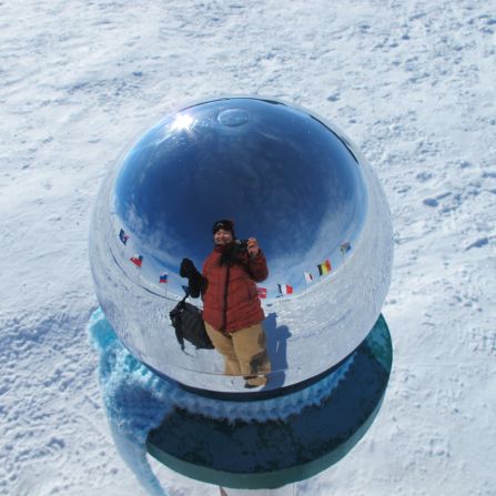 Keri Nelson snaps a selfie at the ceremonial South Pole at Amundsen-Scott South Pole Station.