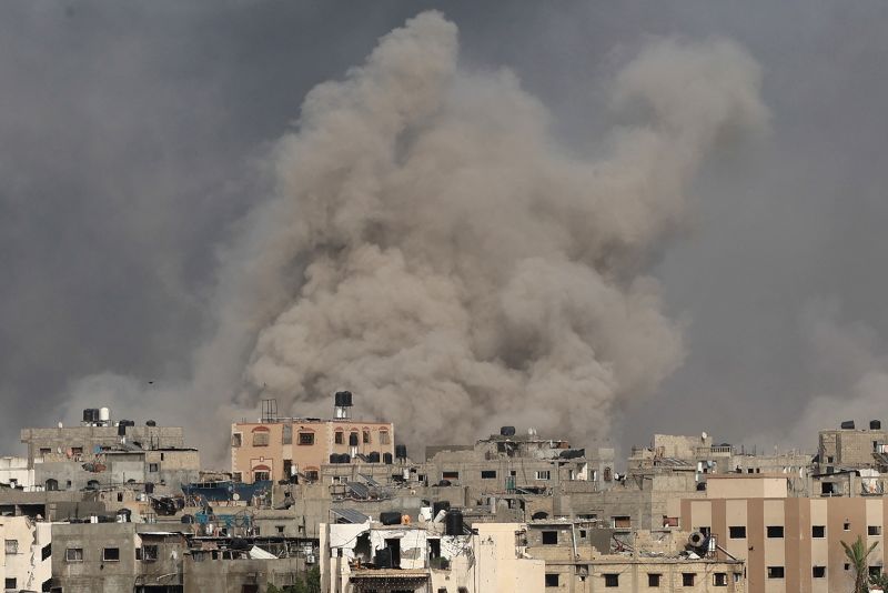 Smoke billows after an Israeli strike on Jabalia as seen from Beit Lahia, in the northern Gaza Strip on May 19, 2024, amid the ongoing conflict between Israel and the militant Hamas group. 
