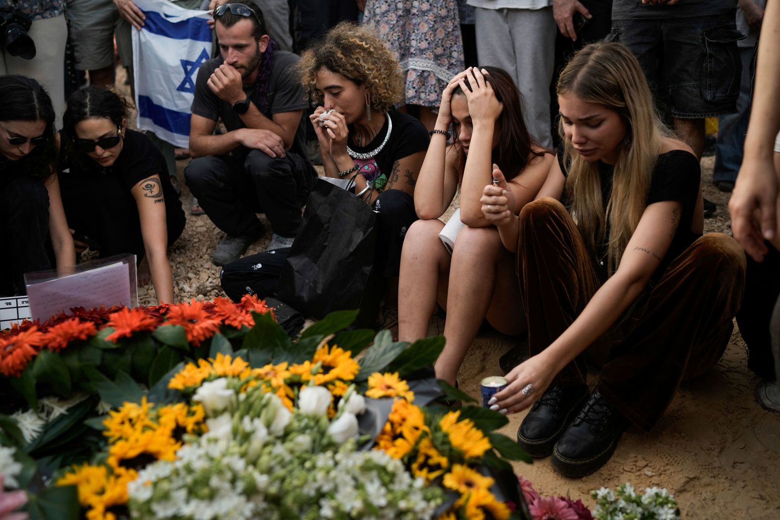 Mourners attend the funeral of <a href="index.php?page=&url=https%3A%2F%2Fwww.cnn.com%2F2024%2F05%2F17%2Feurope%2Fhostages-recovered-gaza-idf-intl%2Findex.html" target="_blank">Shani Louk</a> in Srigim, Israel, on Sunday, May 19. Louk, a 23-year-old German-Israeli woman, was killed while trying to escape the Nova music festival during Hamas' October 7 attacks. <a href="index.php?page=&url=https%3A%2F%2Fwww.cnn.com%2Fmiddleeast%2Flive-news%2Fisrael-hamas-war-gaza-news-05-19-24%2Fh_88d91a241e9a636784ced70e649002b9" target="_blank">Her remains were retrieved from Gaza</a> in an Israel Defense Forces operation.