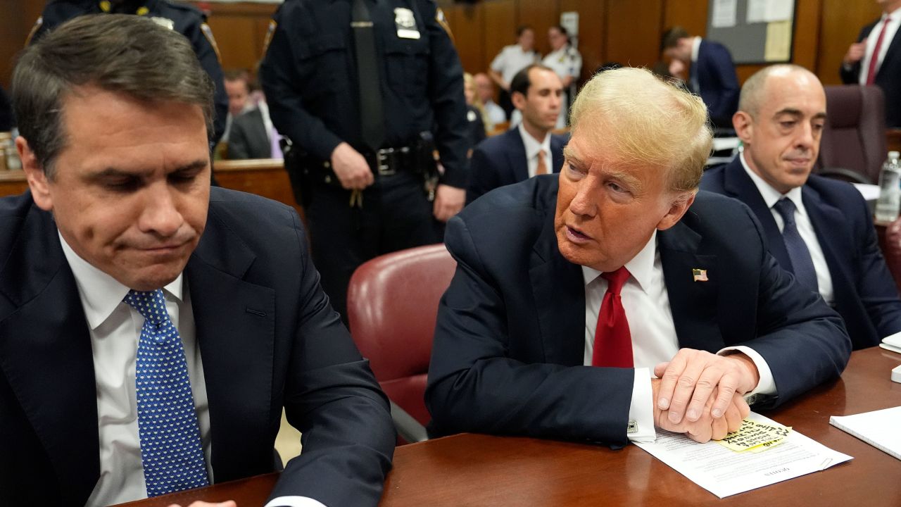 Former President Donald Trump speaks to his attorney Todd Blanche before the start of proceedings in Manhattan Criminal Court, Tuesday, May 28, 2024, in New York.