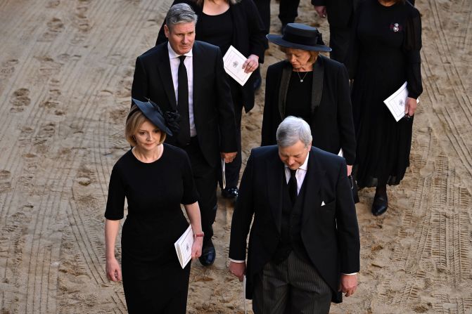 Starmer walks behind British Prime Minister Liz Truss during the ceremonial procession of the coffin of Queen Elizabeth II in September 2022.