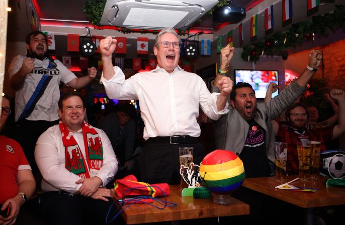 Starmer celebrates an England goal as he watches a World Cup match from London in November 2022.