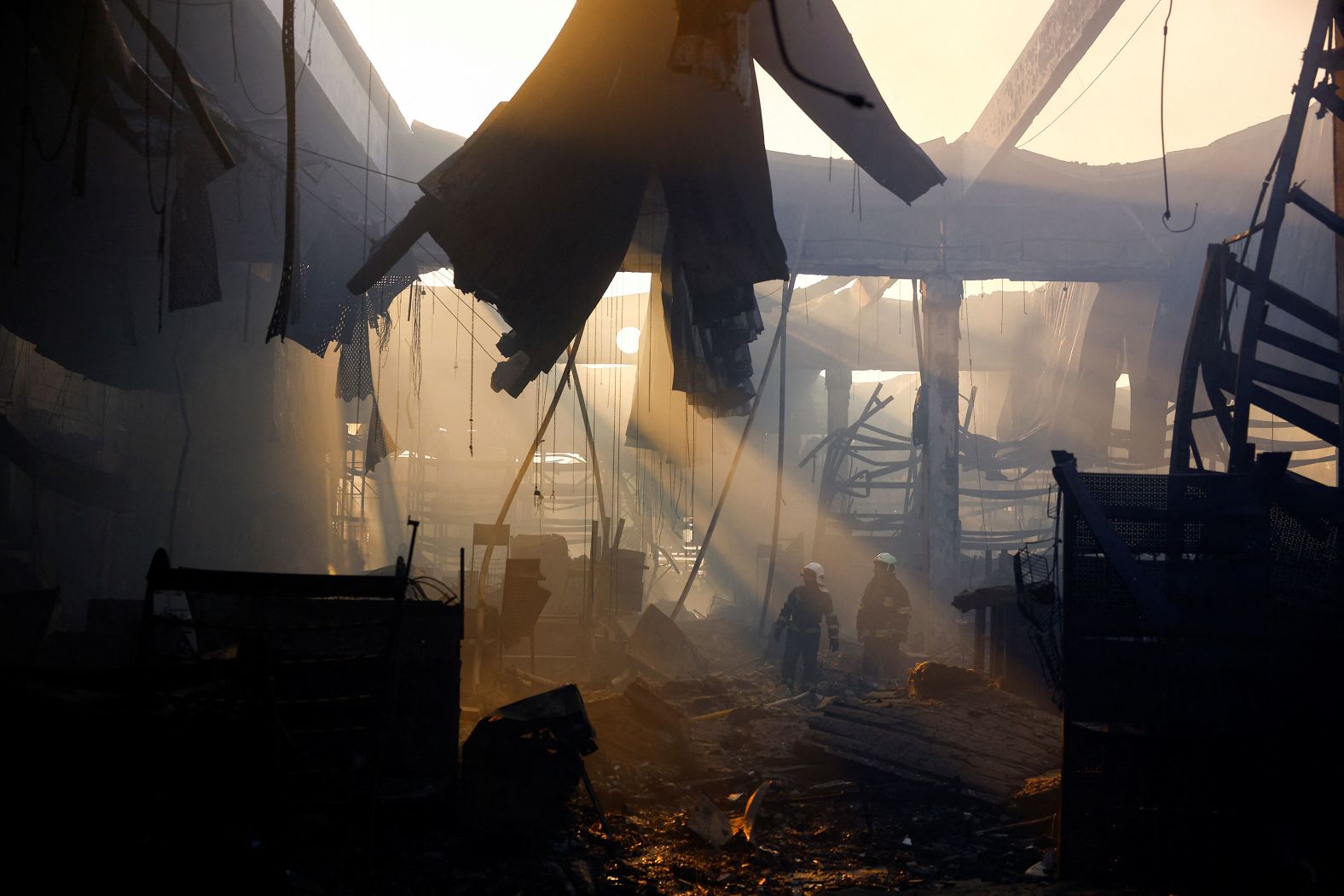 Firefighters work at the site of a shopping center building <a href="index.php?page=&url=https%3A%2F%2Fwww.cnn.com%2F2024%2F05%2F27%2Feurope%2Frussian-strike-kharkiv-megastore-intl%2Findex.html" target="_blank">that was hit by a Russian airstrike</a> in Kharkiv, Ukraine, on Saturday, May 25. At least 18 people were killed, regional officials said on Monday, making it the deadliest attack Ukraine has endured in several weeks. Kharkiv, which sits near Ukraine's border with Russia, has seen a spate of Russian attacks in recent weeks.