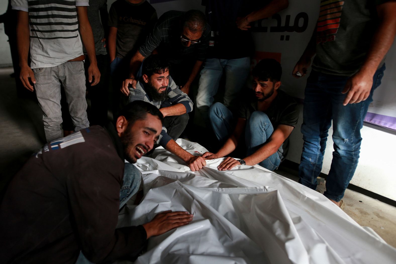 Palestinians at a morgue in Rafah, Gaza, mourn over the bodies of relatives on Monday, May 27. The relatives were killed in an <a href="index.php?page=&url=https%3A%2F%2Fwww.cnn.com%2F2024%2F05%2F27%2Fmiddleeast%2Fgaza-rafah-displaced-people-camp-israel-strike-mime-intl%2Findex.html" target="_blank">Israeli airstrike that hit a displacement camp</a> on Sunday.