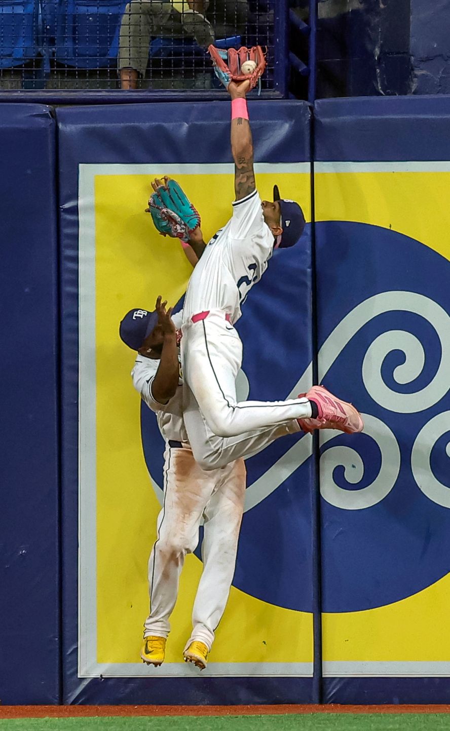 Tampa Bay Rays outfielder Jose Siri collides with teammate Randy Arozarena as he makes a ninth-inning catch during a Major League Baseball game on Wednesday, May 29. Siri then singled in the winning run in the bottom of the ninth as the Rays defeated Oakland 4-3.