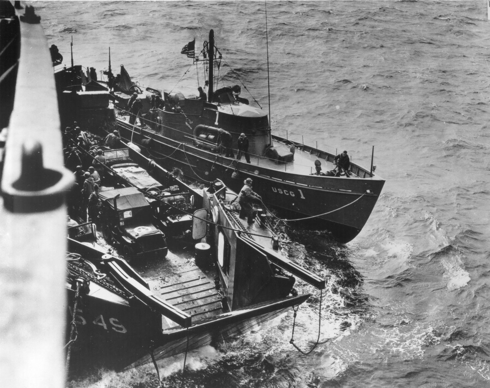 US Coast Guard boats are seen off Omaha Beach on the morning of D-Day. Troops left the USS Samuel Chase early that day to head to Normandy. "When the order 'Lower Away' came, everything was quiet," Sargent recalled. "Just the squeaking of the davits and the whispered comments of the men were heard. The soldiers were silent."