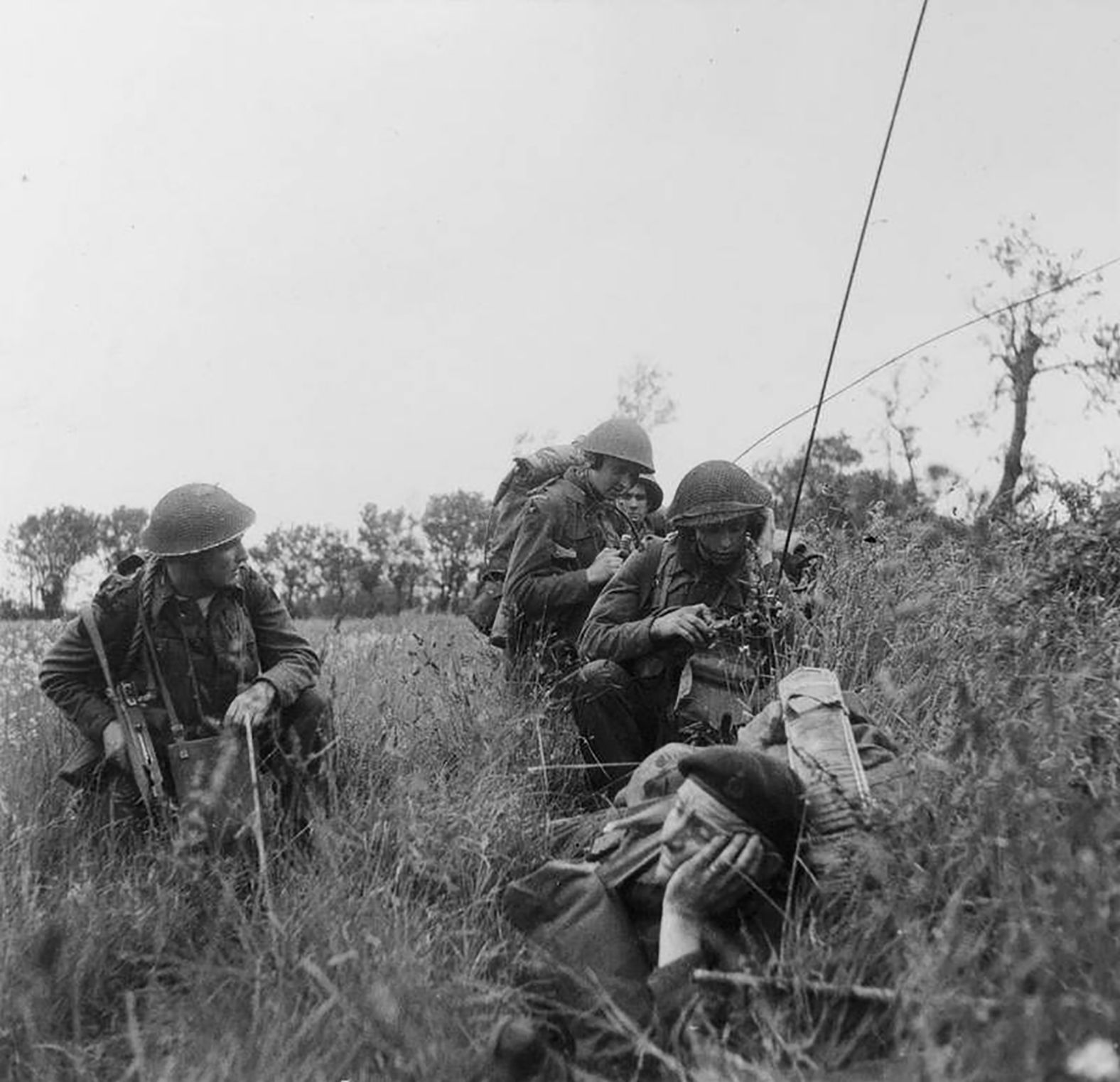 British troops use radios during the move inland.