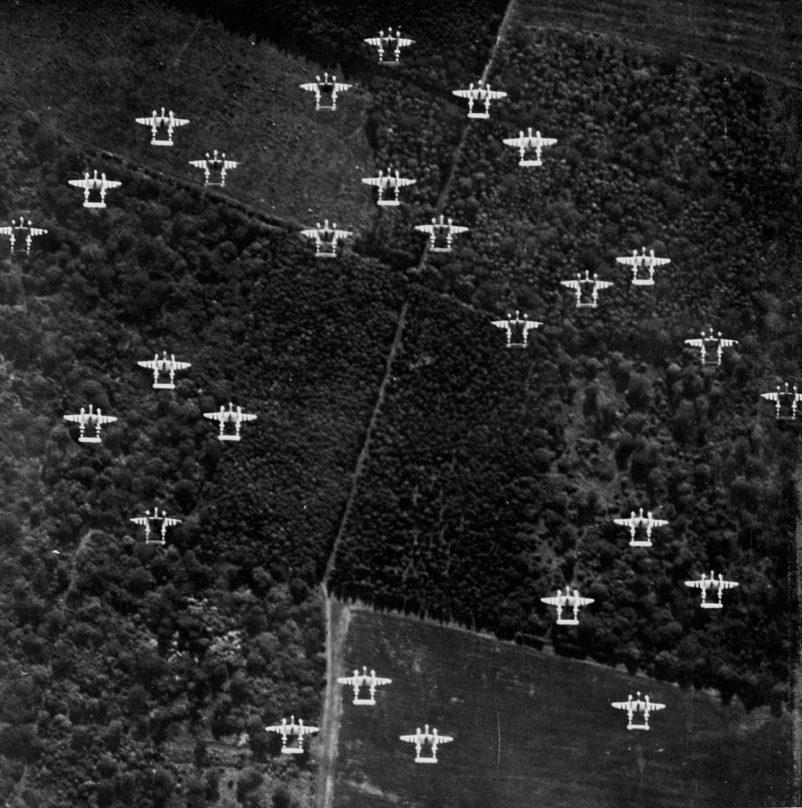 A squadron of Lockheed P-38 Lightnings, under the command of US Air Force Lt. Col. Clarence Shoop, fly across the English countryside on their way to France on D-Day.