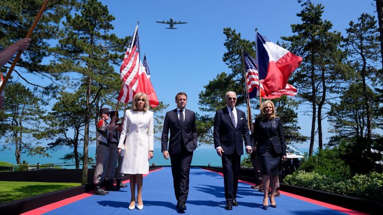 President Joe Biden, first lady Jill Biden, French President Emmanuel Macron, his wife Brigitte Macron, walk on stage during ceremonies to mark the 80th anniversary of D-Day, Thursday, June 6, 2024, in Normandy. (AP Photo/Evan Vucci)