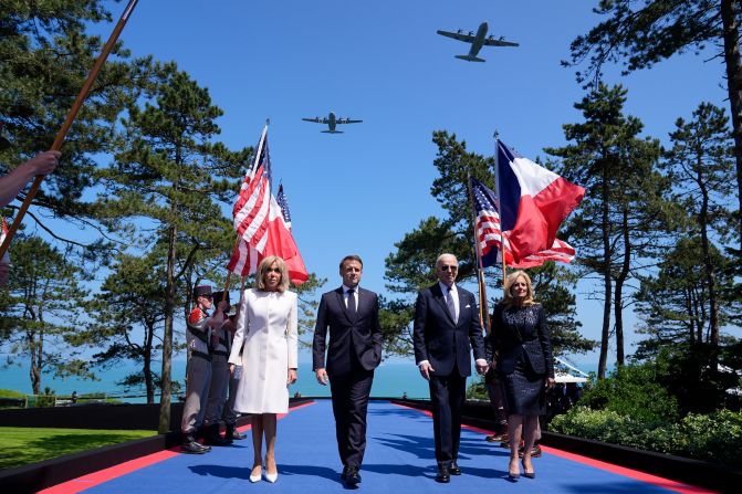 From left, French first lady Brigitte Macron, French President Emmanuel Macron, US President Joe Biden and US first lady Jill Biden arrive for a D-Day ceremony at the Normandy American Cemetery and Memorial in Colleville-sur-Mer, France, on Thursday, June 6.