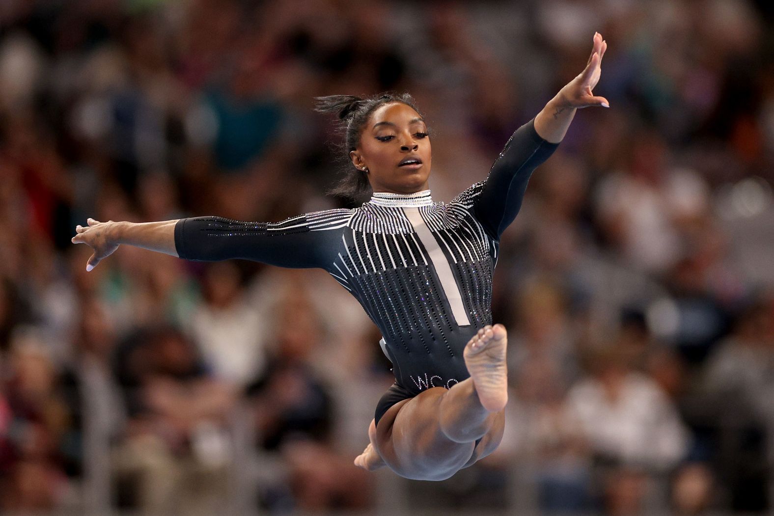 <a href="index.php?page=&url=http%3A%2F%2Fwww.cnn.com%2F2019%2F10%2F11%2Fsport%2Fgallery%2Fsimone-biles%2Findex.html" target="_blank">Simone Biles</a> competes in the floor exercise at the US Gymnastics Championships on Friday, May 31. She would later win <a href="index.php?page=&url=https%3A%2F%2Fwww.cnn.com%2F2024%2F06%2F02%2Fsport%2Fsimone-biles-xfinity-us-gymnastics-championships-second-day-spt-intl%2Findex.html" target="_blank">a record-extending ninth national title</a> in the all-around.