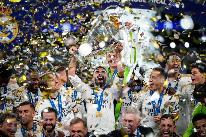 Real Madrid players celebrate with the trophy after <a href="https://www.cnn.com/2024/06/01/sport/champions-league-final-borussia-dortmund-real-madrid-spt-intl/index.html" target="_blank">winning the Champions League final</a> on Saturday, June 1. Madrid defeated Borussia Dortmund 2-0 to win its record-extending 15th European Cup. 