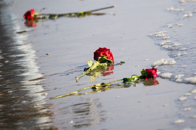 Flowers lie on the shore of Utah Beach as a tribute to soldiers who died there 80 years ago.