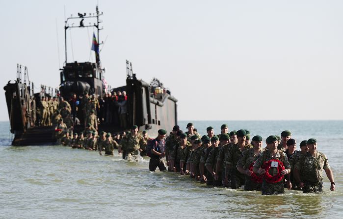 The Royal Marines of 47 Commando land on a beach in Normandy as part of the commemorations on Thursday.