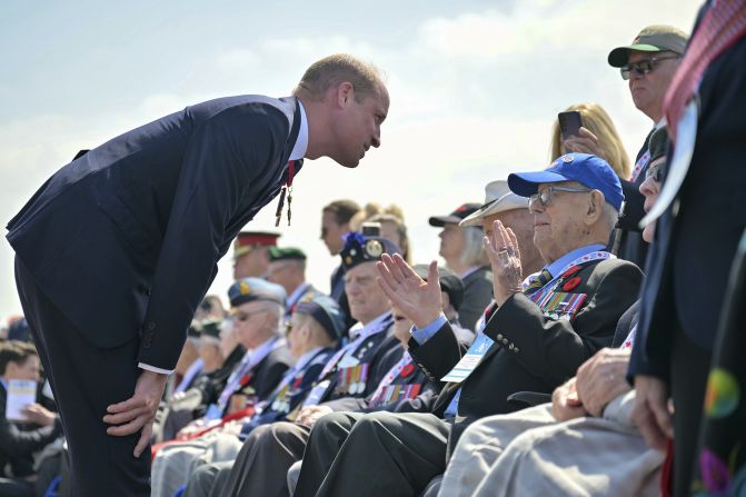 Britain's Prince William speaks to World War II veterans during a ceremony at the Juno Beach Centre near Courseulles-sur-Mer, France, on Thursday.