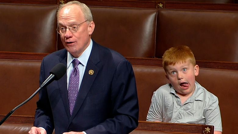 This image from House Television shows Rep. John Rose, R-Tenn., speaking on the floor of the House of Representatives Monday, June 3, 2024, in Washington, as his son Guy makes a face. (House Television via AP)