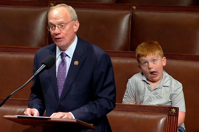 This image, taken from House Television, shows US Rep. John Rose speaking on the floor of the House of Representatives as his son Guy makes a face on Monday, June 3. <a href="https://x.com/RepJohnRose/status/1797688453209211143" target="_blank" target="_blank">Rose later posted the video on X</a>, saying, "This is what I get for telling my son Guy to smile at the camera for his little brother."