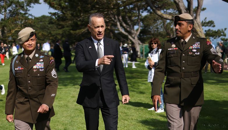 Actor Tom Hanks attends the ceremony at the Normandy American Cemetery and Memorial. <a href="index.php?page=&url=https%3A%2F%2Fwww.cnn.com%2Feurope%2Flive-news%2Fd-day-80-anniversary-06-06-24-intl%2Fh_4129953db7c8c45dcac0c73841dab71e" target="_blank">Hanks spoke with CNN's Christiane Amanpour</a> about democracy, saying he believes the US and Western societies "cannot help but turn towards what is right."