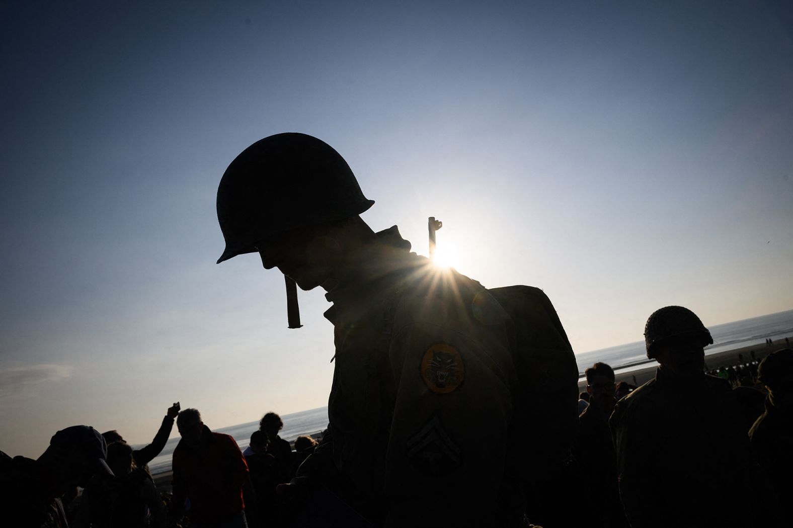 A man wears World War II-era attire on Utah Beach.